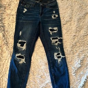 Judy blue distressed jeans with navy patches behind the distressing! Size 5/27